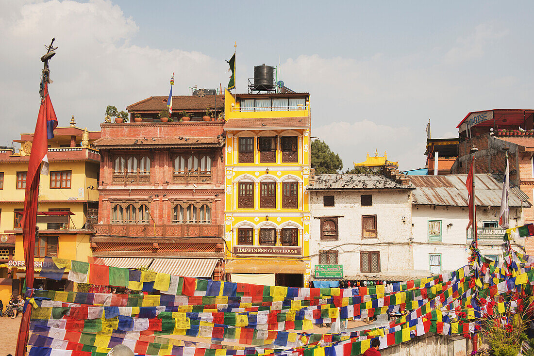 'Buildings and prayer flags on the main square; Boudhanath, Nepal'