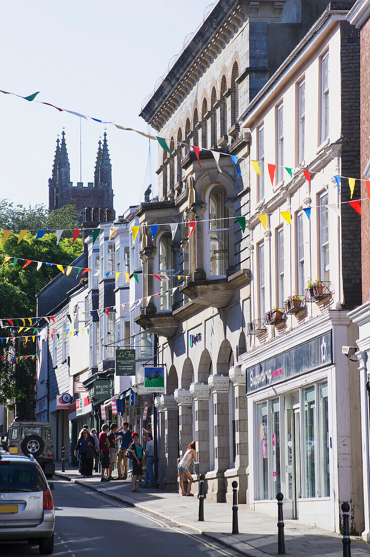 'Pedestrians and shops; Devon, England'