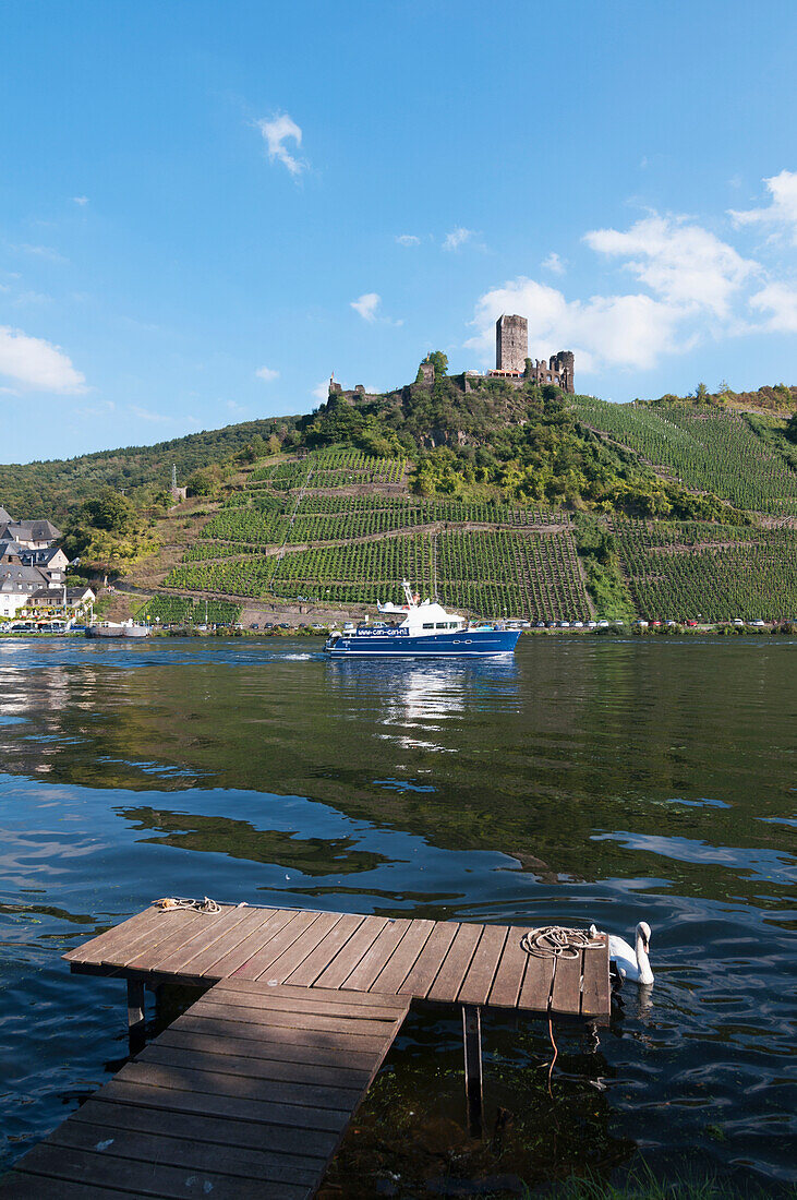 'A boat on Moselle river with vineyards on the slopes; Mosel, Germany'