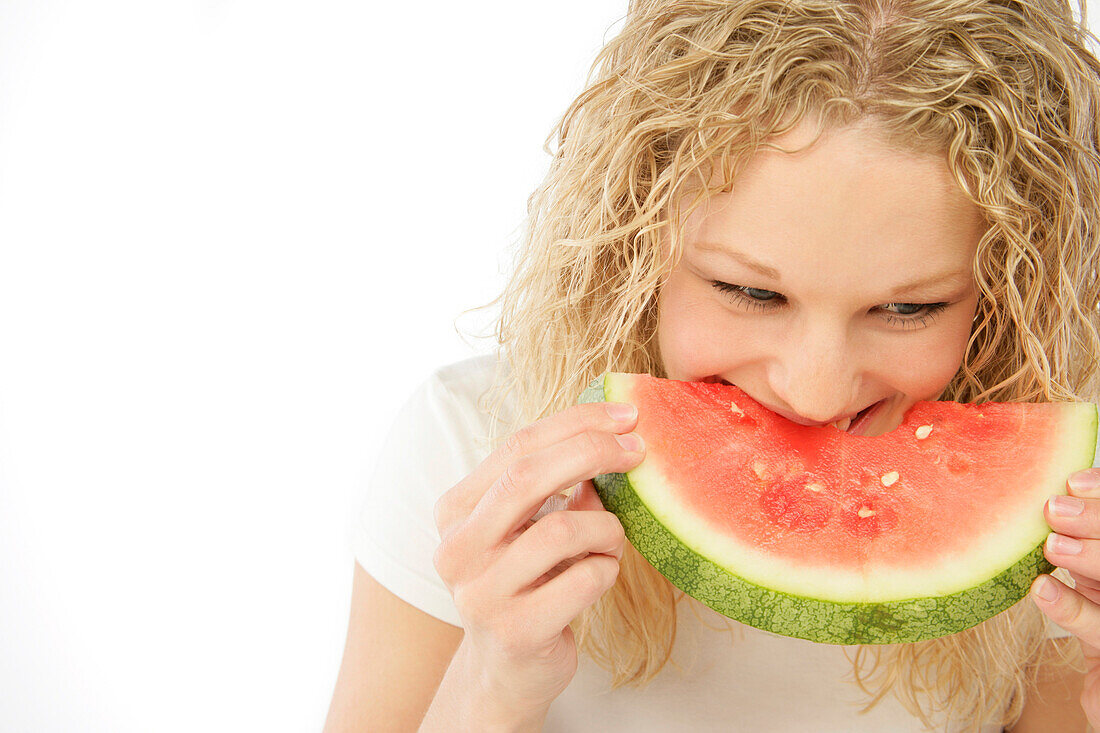 Woman Enjoying A Slice Of Watermelon
