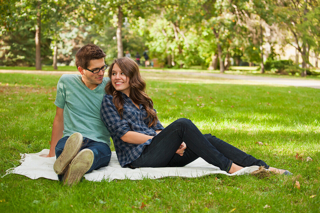 'Newlywed Couple Spending Quality Time Together In A Park; Edmonton, Alberta, Canada'