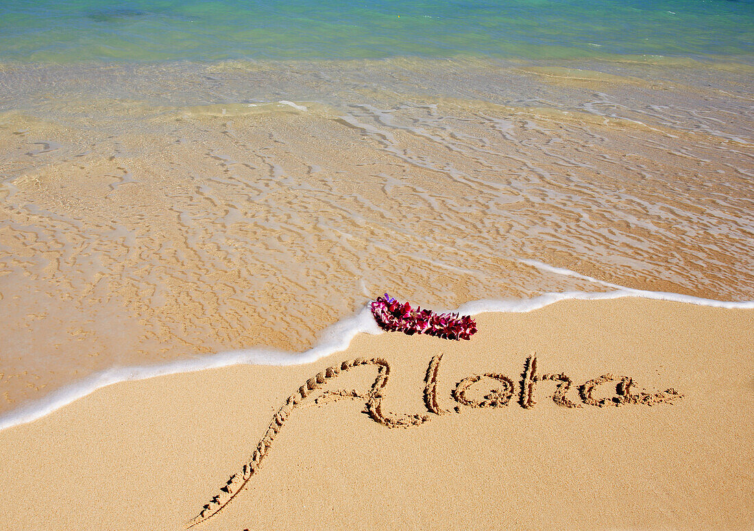 Hawaii, Turquoise Ocean Waters, Foaming Shore Water, Orchid Lei, Aloha Written In Sand
