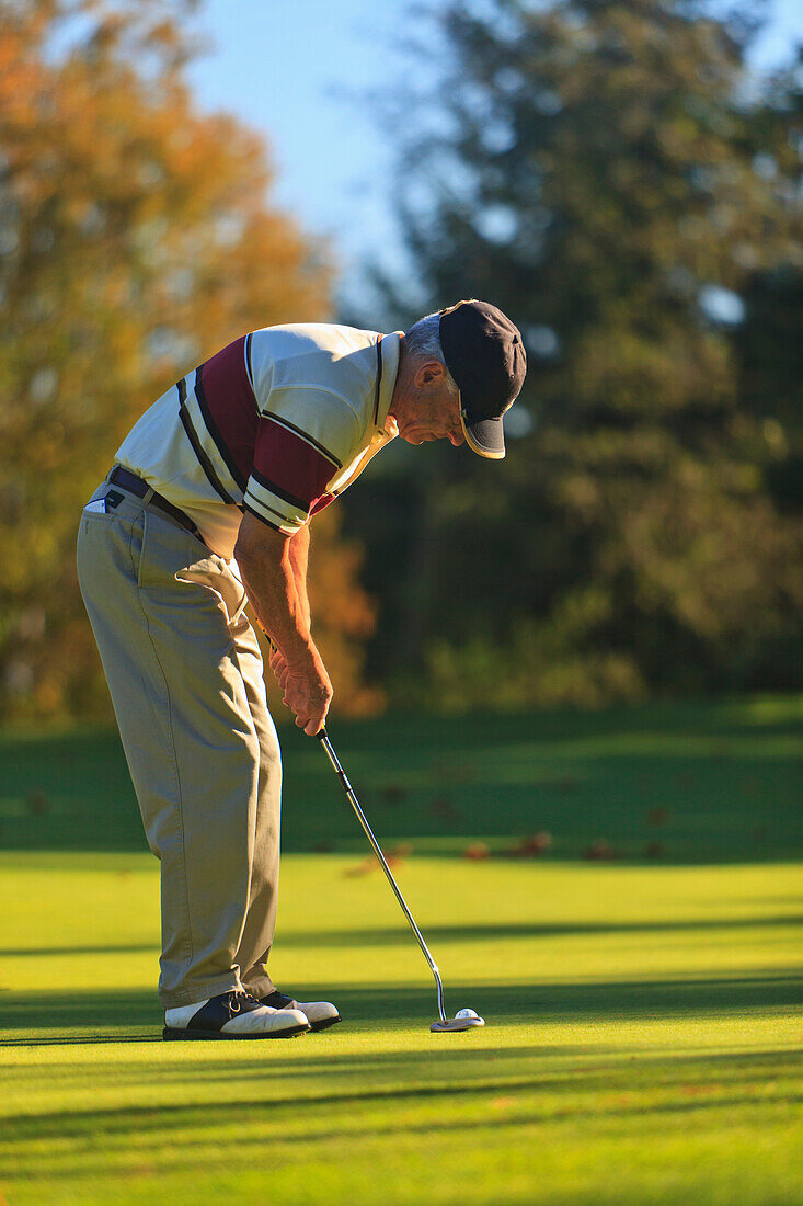'A Man Golfing At Lynnwood Golf Course; Lynnwood, Washington, United States of America'
