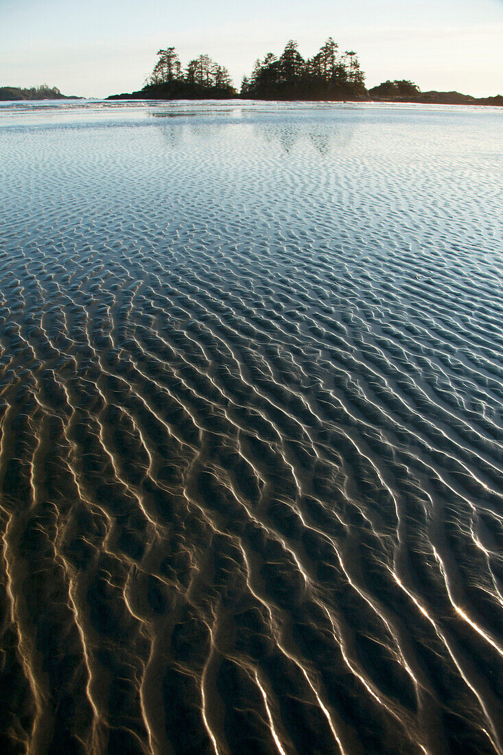 'Ripples Form In The Sand At Chesterman's Beach And Frank Island Near Tofino; British Columbia, Canada'