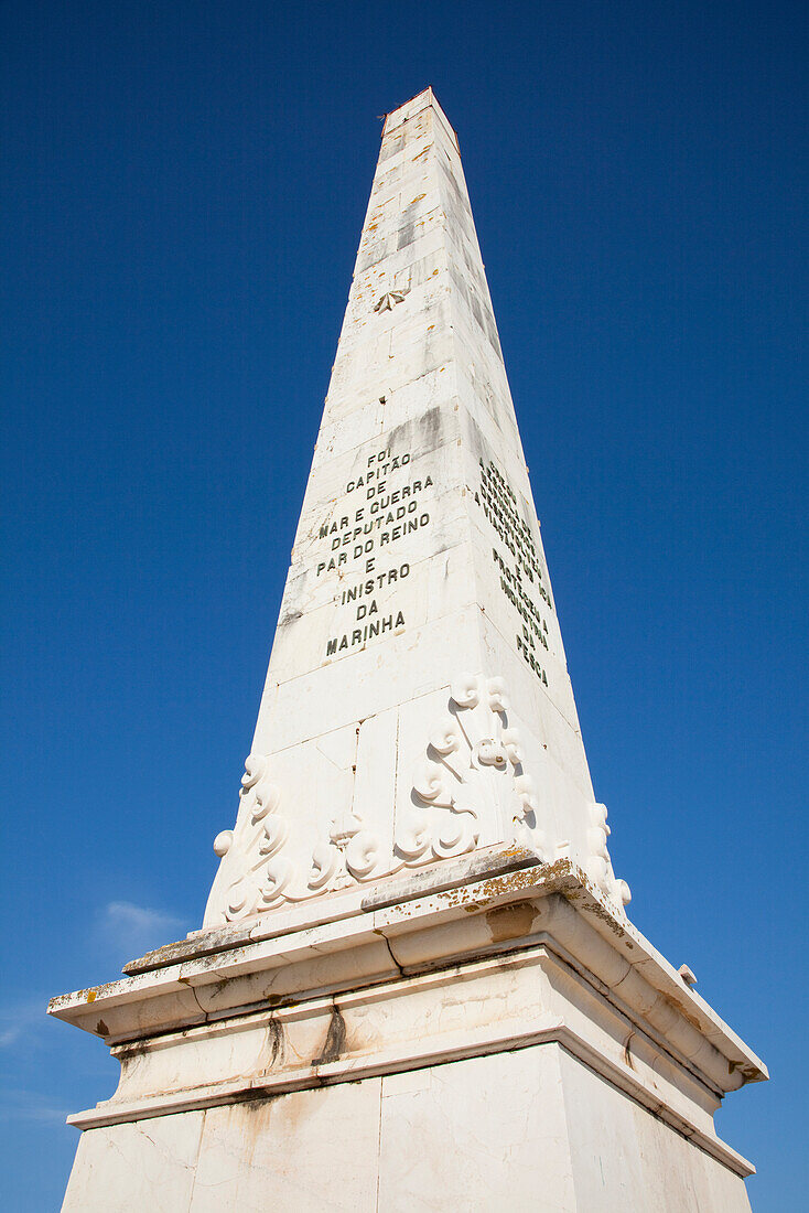 'Tall Monument Against A Blue Sky; Faro Algarve, Portugal'