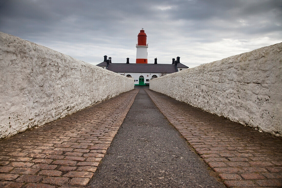 'A Path Leading To A Red And White Lighthouse; South Shields, Tyne And Wear, England'