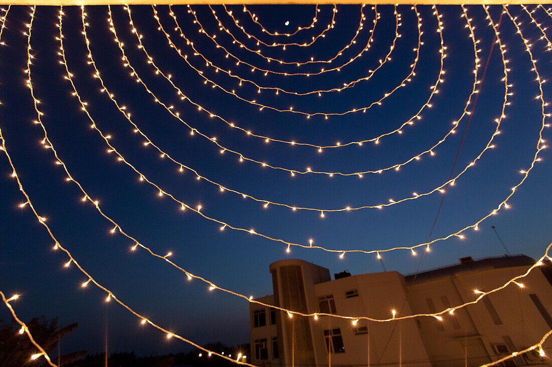 'Small White Lights Strung In A Circular Pattern Against A Night Sky; Ludhiana, Punjab, India'