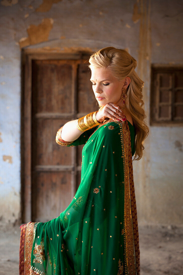 'A Woman With Long Blond Hair Wearing A Sari; Ludhiana, Punjab, India'
