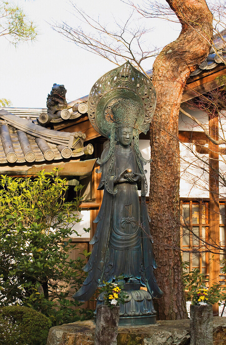 'Japanese temple statue in morning light;Kyoto japan'