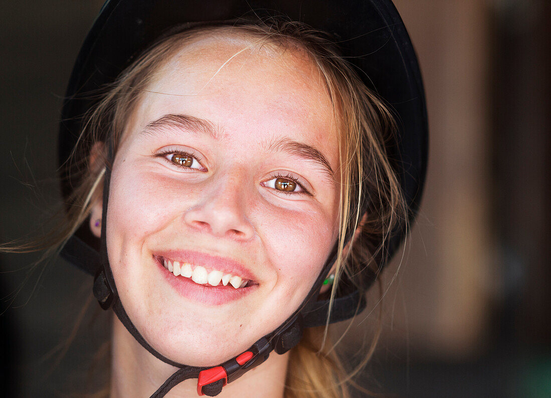 'Portrait of a young woman equestrian wearing a black helmet;Mijas malaga andalusia spain'