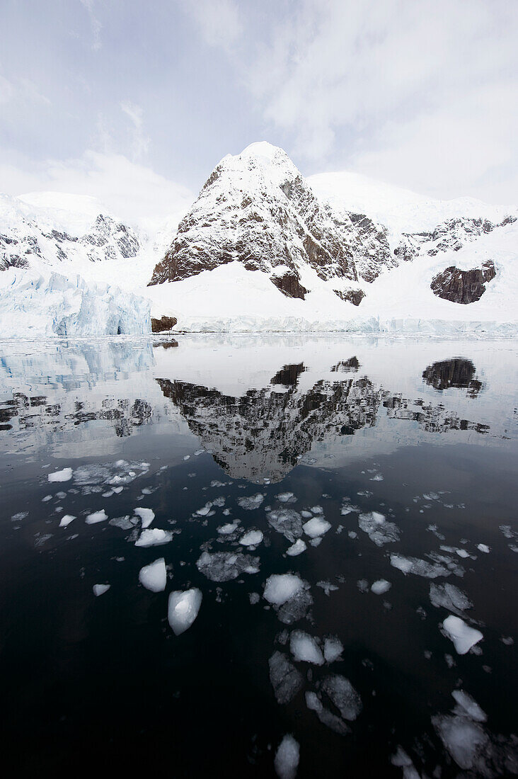 'Mountains and glaciers reflected in the water;Antarctica'