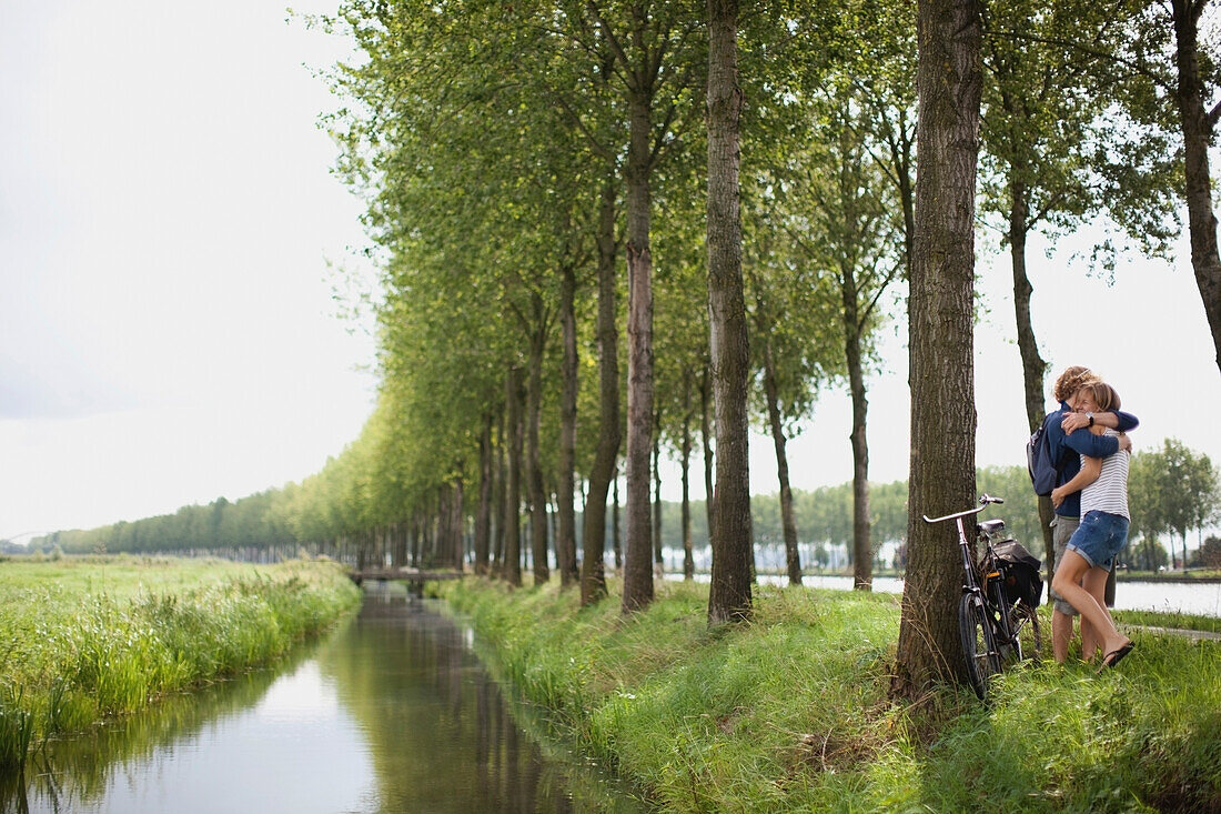 'A Couple Hugging Near A River; Houten, The Netherlands'