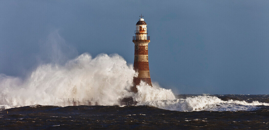 'Waves Crashing Against A Lighthouse; Sunderland, Tyne And Wear, England'