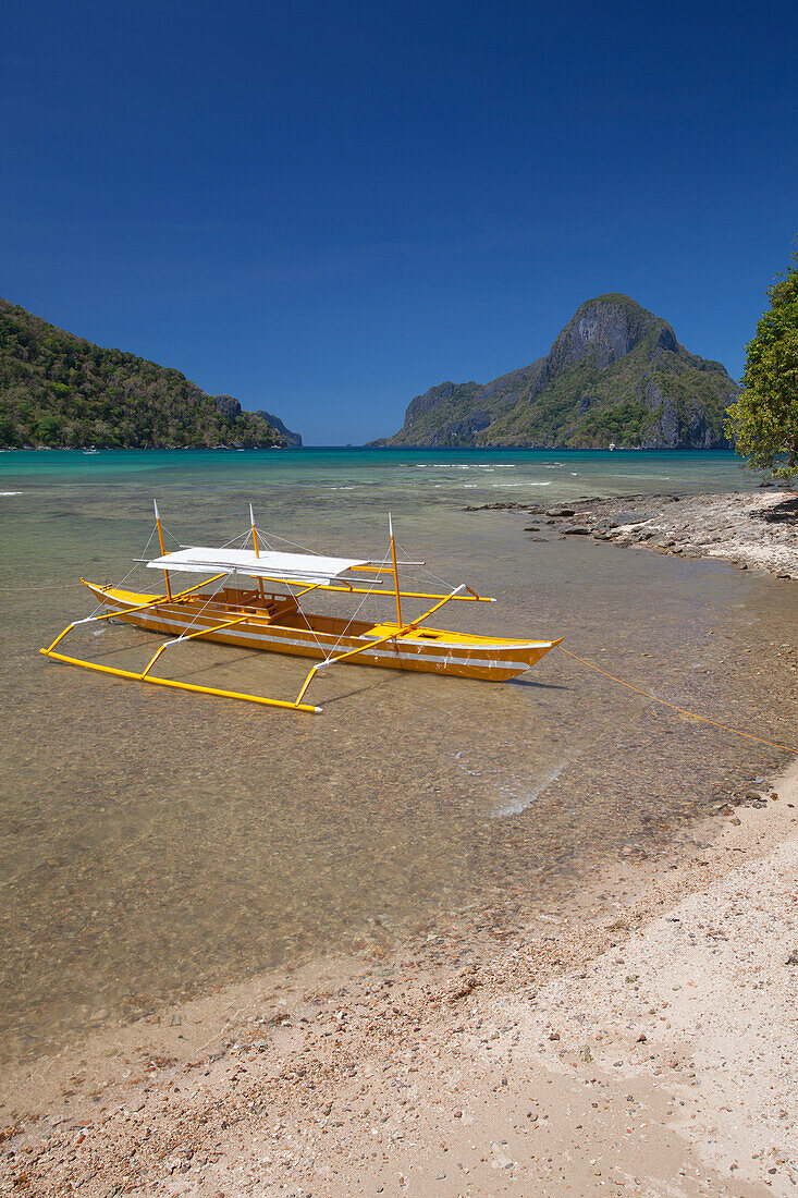 'A Tradional Wooden Bangka Boat Sits In The Picturesque And Scenic Bay; El Nido, Bacuit Archipelago, Palawan, Philippines'