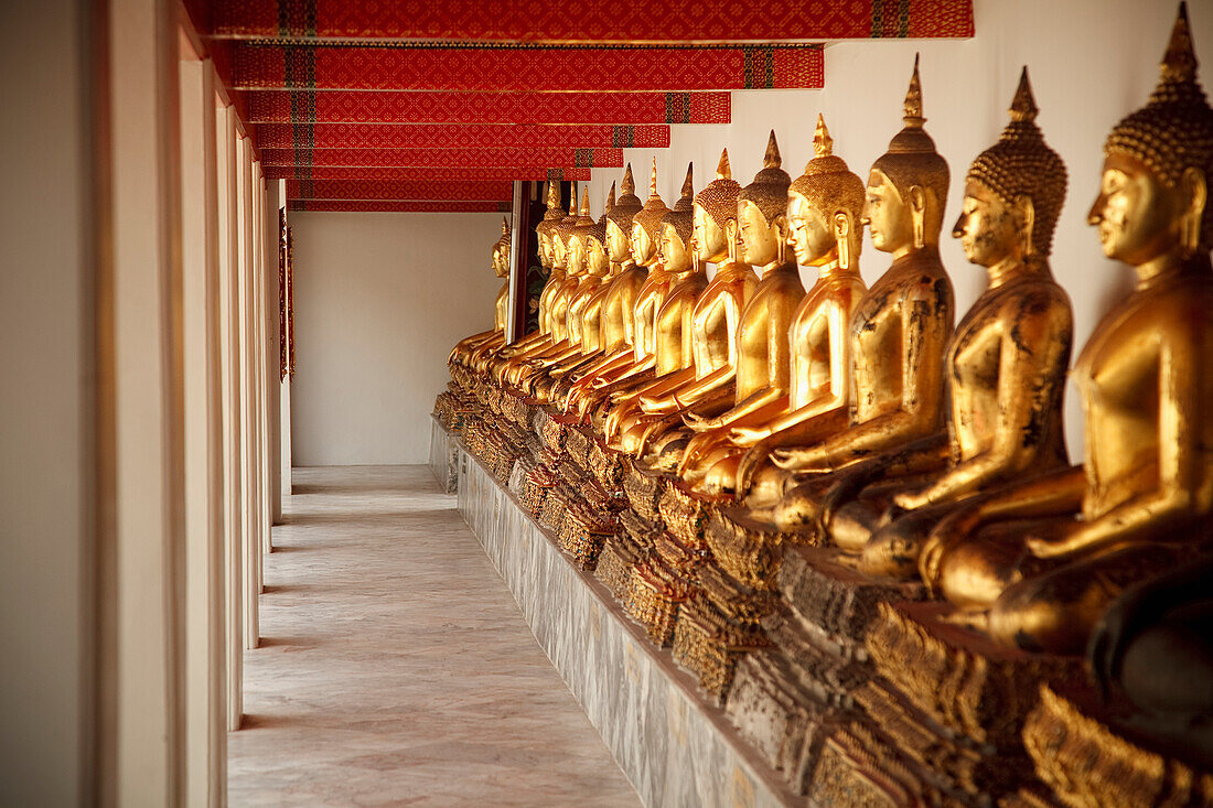 'Seated Golden Buddha Statues In A Row At Wat Pho, Temple Of The Reclining Buddha; Bangkok, Thailand'