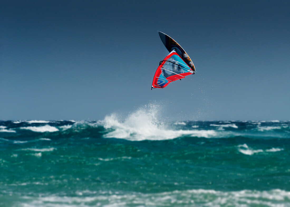 'A Windsurfer Flips Upside Down Above The Water Off Punta Paloma; Tarifa, Cadiz, Andalusia, Spain'