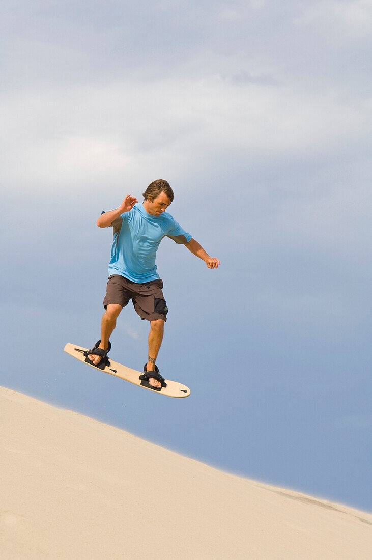 Sandboarder, Honeyman State Park Near Florence, Oregon, Usa