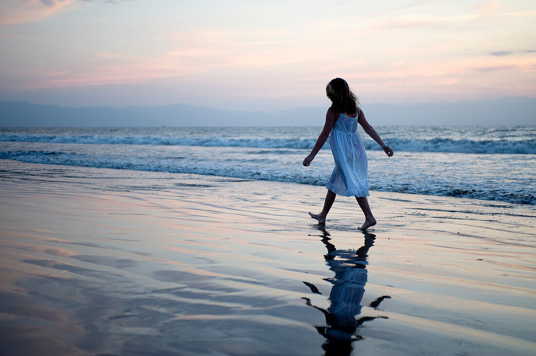 'Puerto Vallarta, Mexico; Girl Walking Along The Beach'