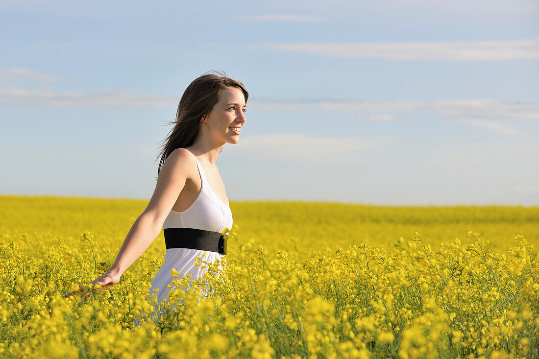 Woman In A Canola Field