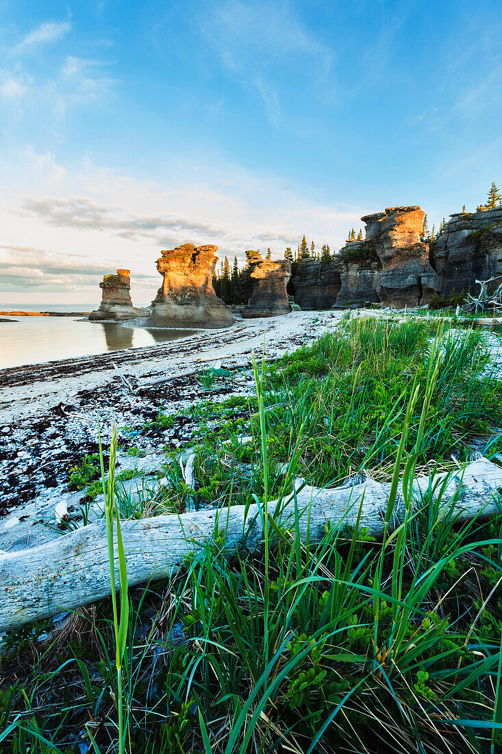 'Monolith at sunset, Anse des Bonnes Femmes at Ile Niapiskau, Mingan Archipelago National Park Reserve of Canada, Cote-Nord, Duplessis region; Quebec, Canada'