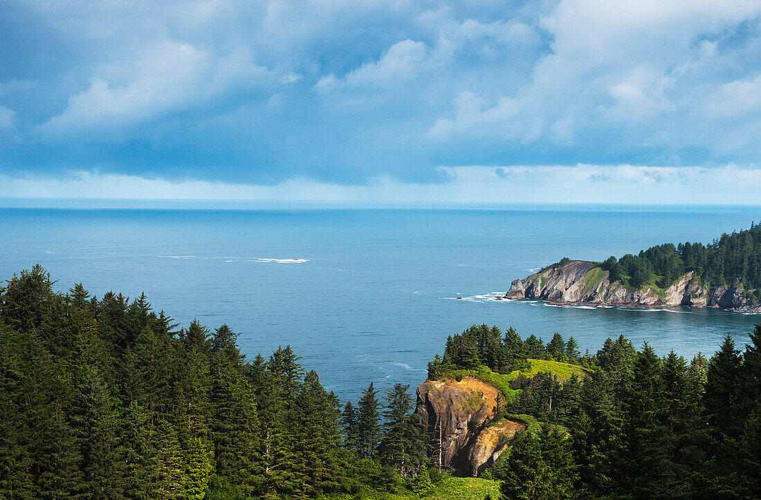 'Sunlight shines on Cape Falcon; Manzanita, Oregon, United States of America'