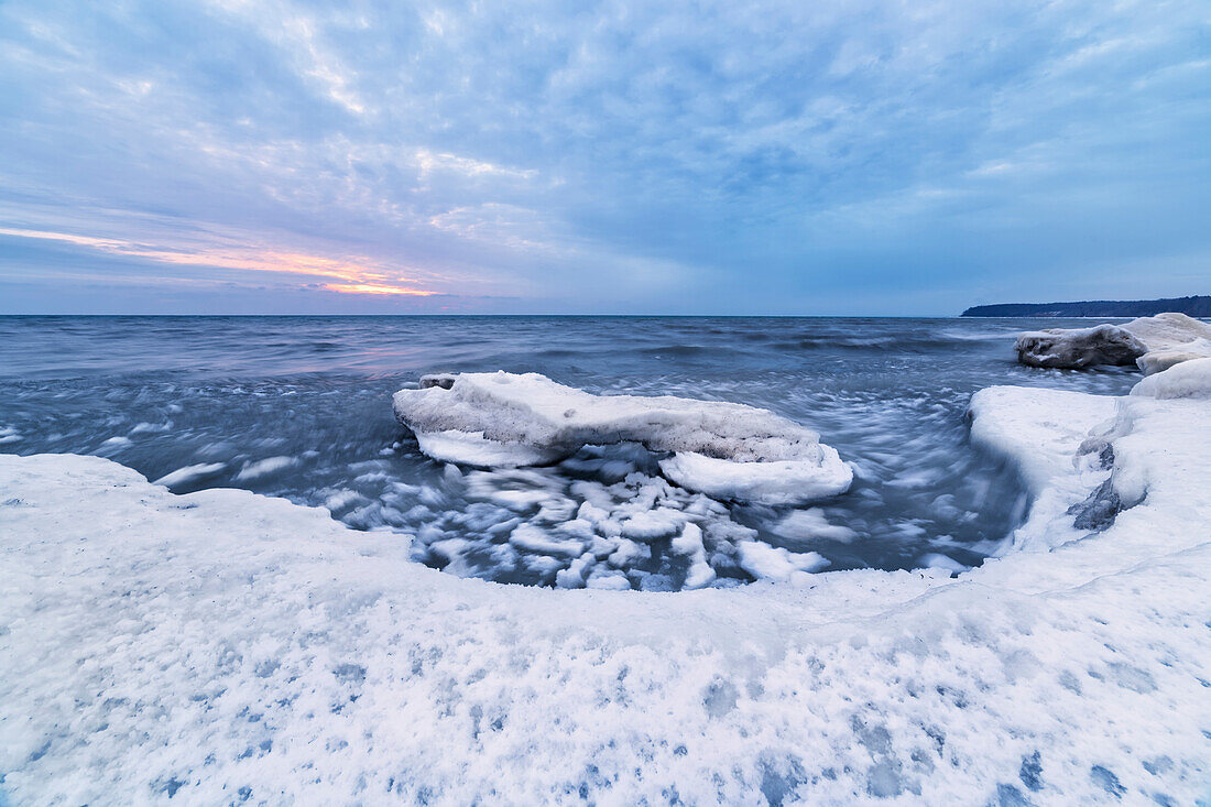 'Cool blue ice and clouds on softer ice on the shores of Lake Michigan; Wisconsin, United States of America'