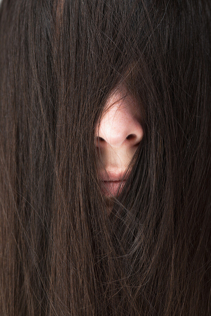 'Woman with hair over her face; Stevenson, Maryland, United States of America'