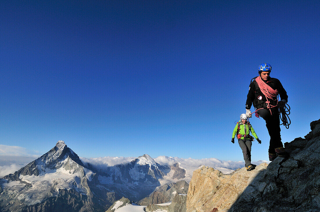 mountaineers on the Arbengrat of Obergabelhorn (4034 m), Matterhorn in the background, Wallis, Switzerland