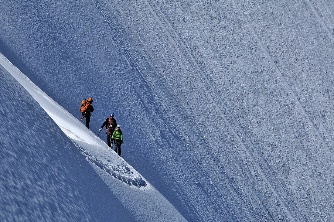 mountaineers in front of the northface of Obergabelhorn (4034 m), Wallis, Switzerland