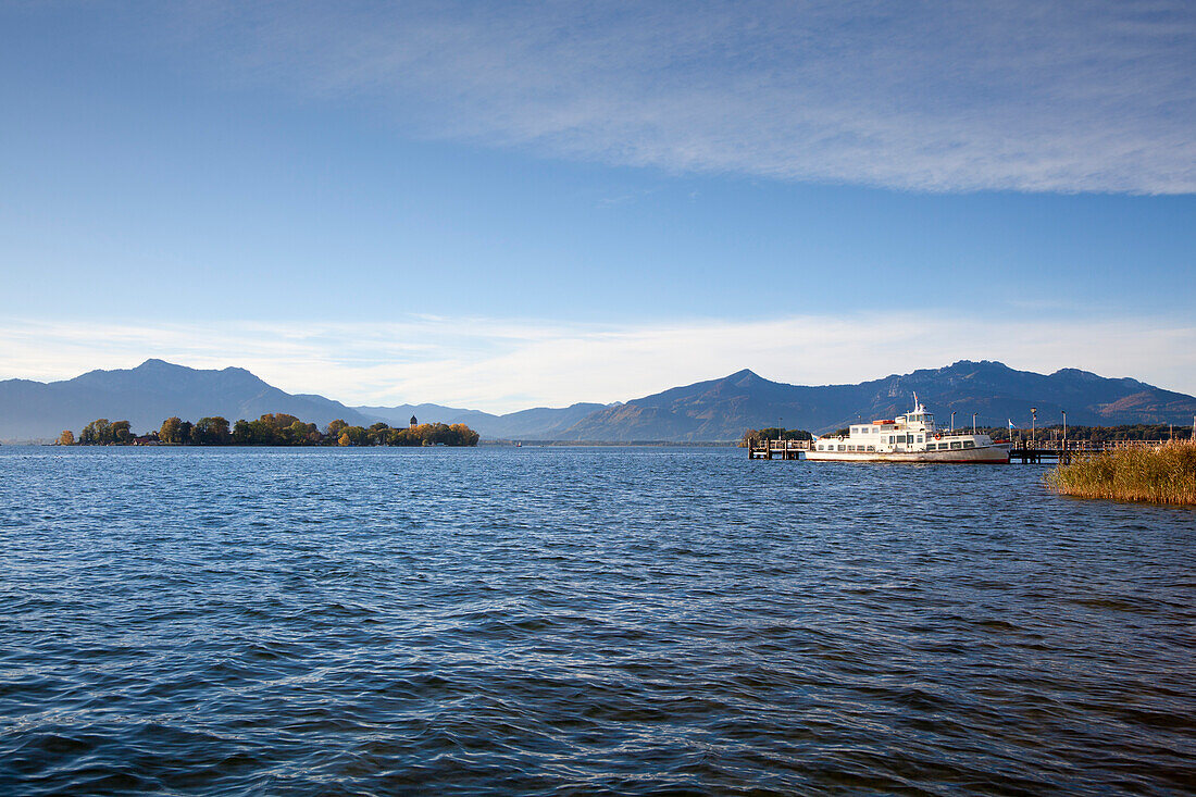 Excursion ship at the landing stage, view to Fraueninsel, near Gstadt, Chiemsee, Chiemgau region, Bavaria, Germany