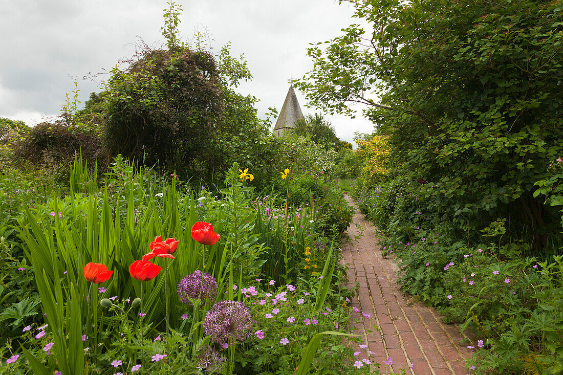 View over the garden to the church, Monk's house, home of the writer Virginia Woolf, Rodmell, East Sussex, Great Britain