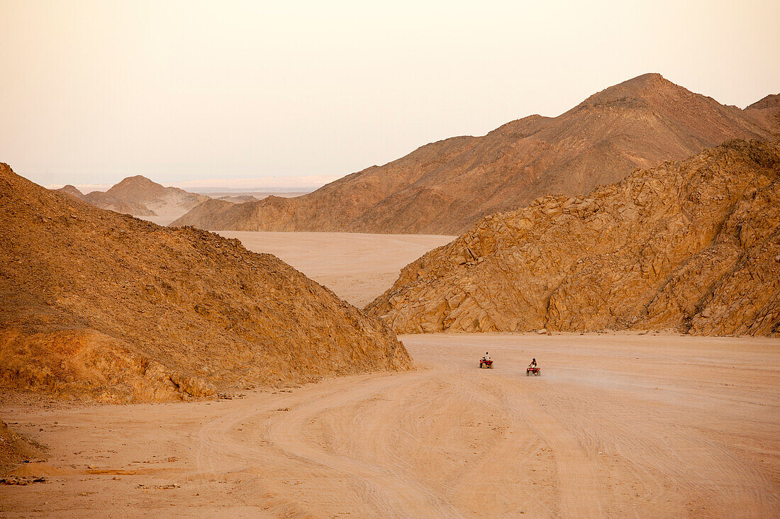 Quad biking in Eastern Desert at sunset, Hurghada, Red Sea, Egypt