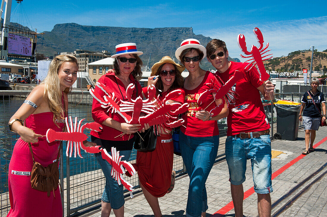 Group of young people with lobster cutouts, Waterfront, Cape Town, Western Cape, South Africa