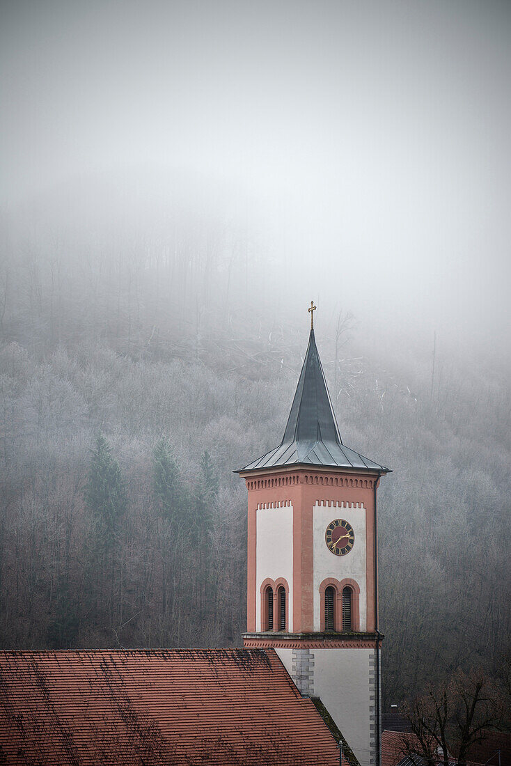 Village church surrounded by hoar frost and fog, near Schelklingen close to Blaubeuren, Schmiech valley, Swabian Alp, Baden-Wuerttemberg, Germany