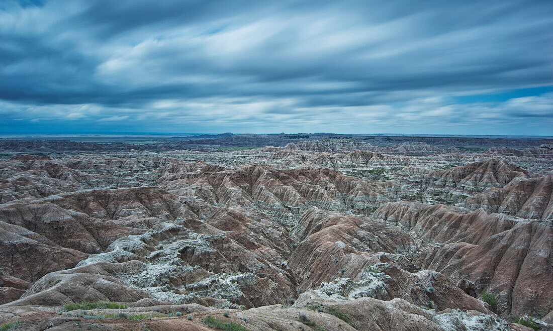 'Long exposure of clouds overtop of badlands national park; south dakota united states of america'