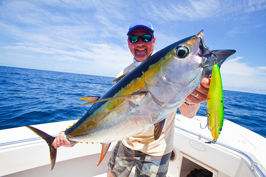 'Man holding just caught yellowfin; panama'