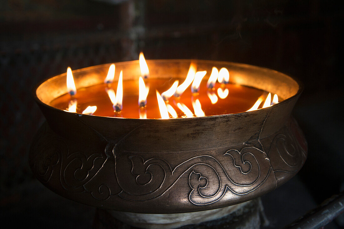 'Flames burning in a bronze container at the jokhang temple;Lhasa xizang china'