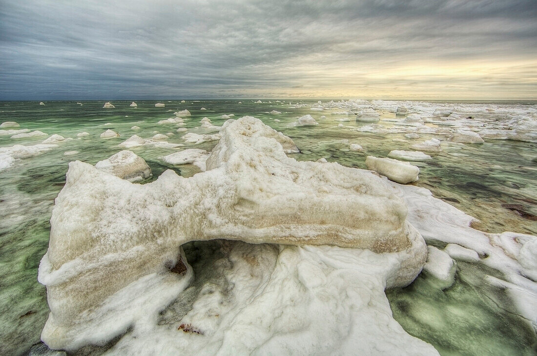 'The green ice filled water of hudson's bay;Manitoba canada'