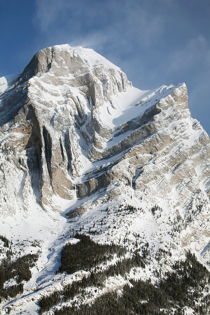 'Snow covered mountain with blue sky and cloud;Kananaskis Country Alberta Canada'