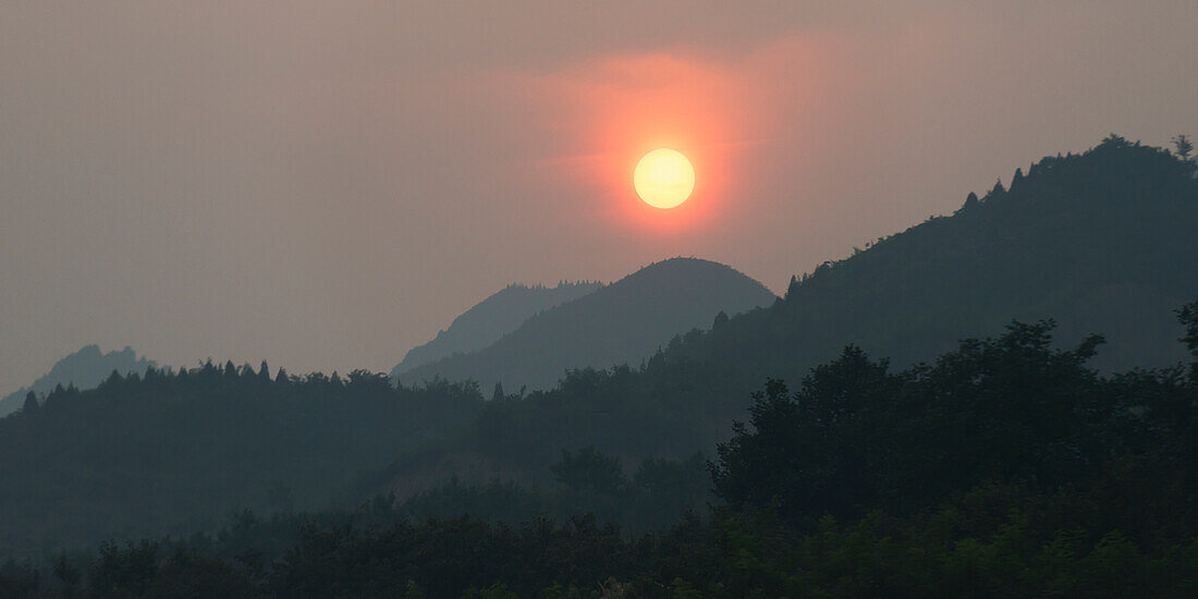 'Glowing sunlight over the mountainous landscape;Beijing China'