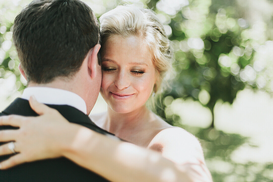 'A bride and groom in an embrace;Pemberton british columbia united states of america'