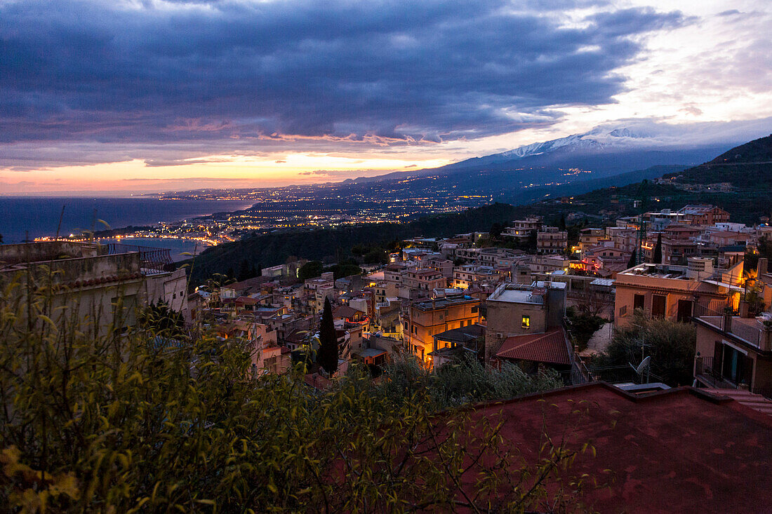 View over Taormina to Mount Etna in the evening, Taormina, Messina, Sicily, Italy