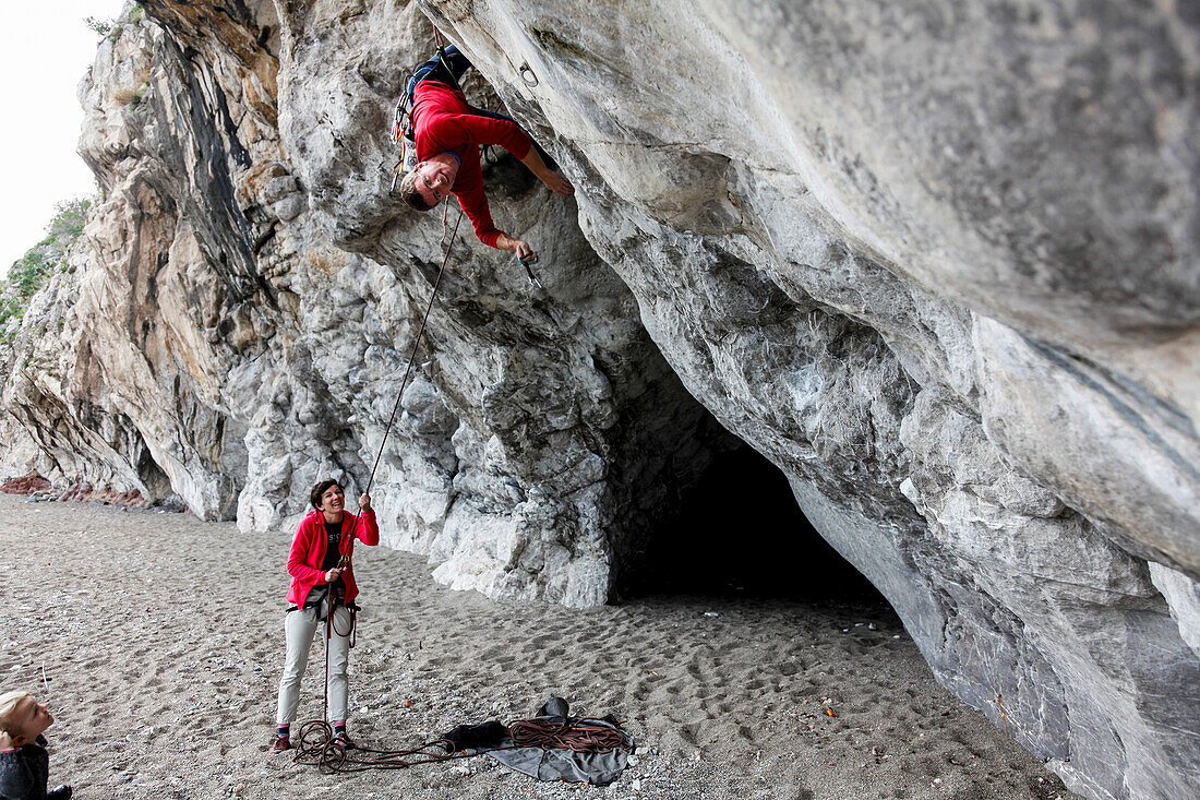 Man rock climbing, Taormina, Messina, Sicily, Italy