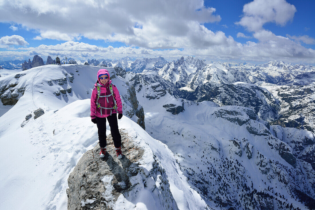 Woman ascending from Hochebenkofel to Birkenkofel, Sexten Dolomites, South Tyrol, Italy