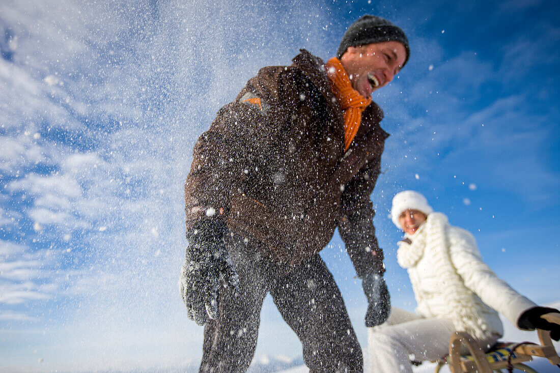 Laughing couple in snow, Muehlen, Styria, Austria