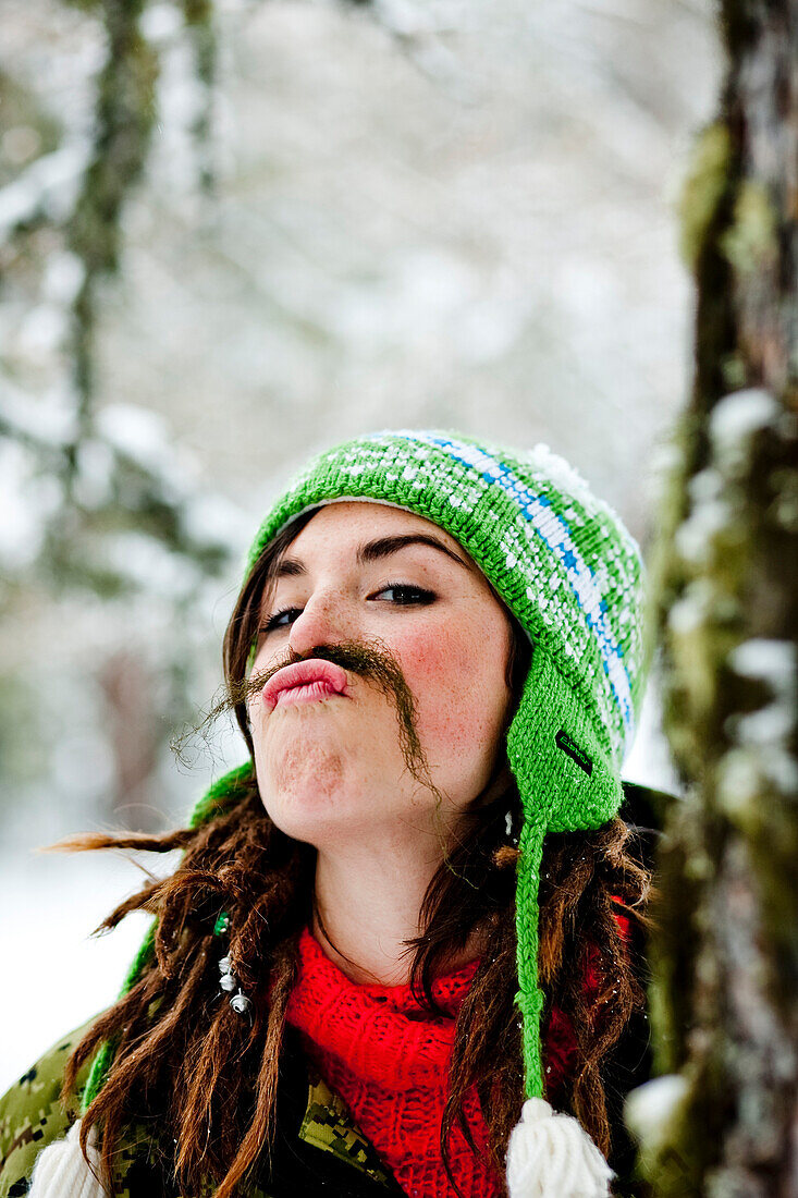 Young woman with a fake beard