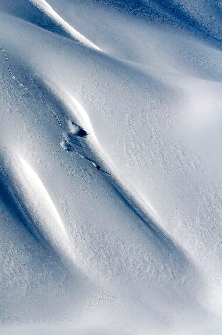 Skier downhill skiing in deep snow, Puma Lodge, Araucania Region, Chile