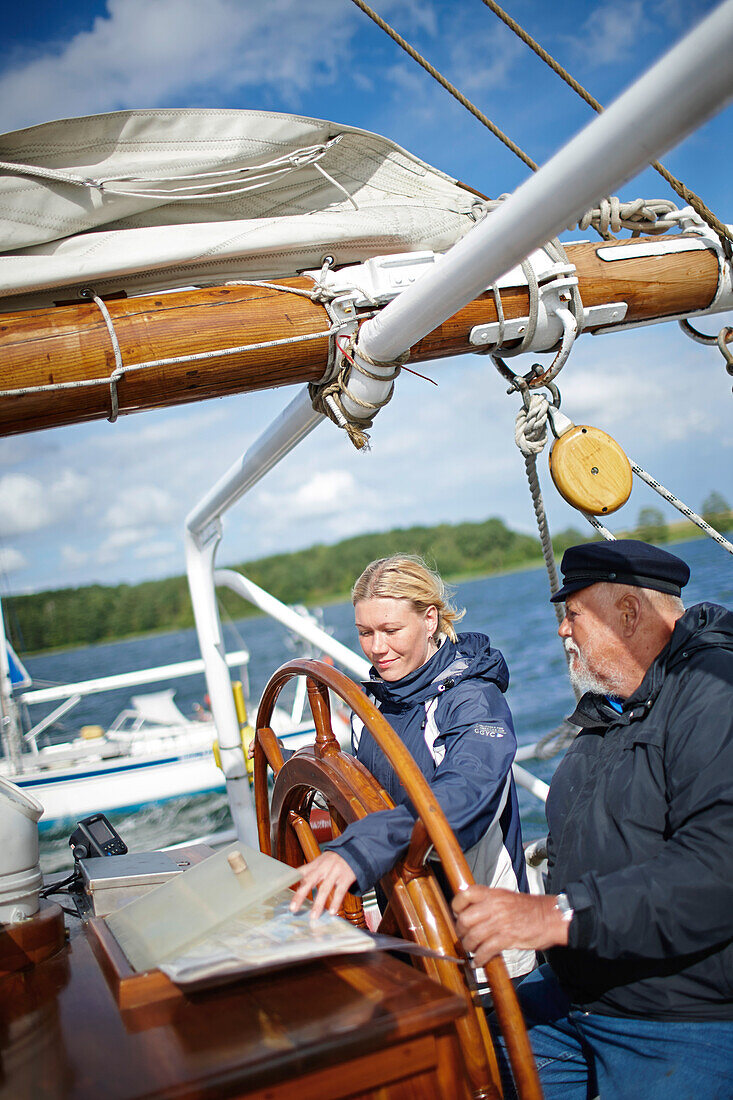 Crew at sailing ship wheel, Stralsund, Mecklenburg-Western Pomerania, Germany