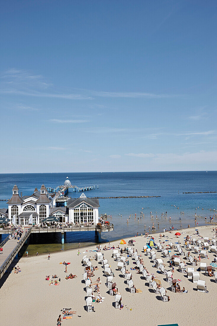 Pier and beach chairs at sandy beach, Baltic sea spa Sellin, island of Ruegen, Mecklenburg-Western Pomerania, Germany