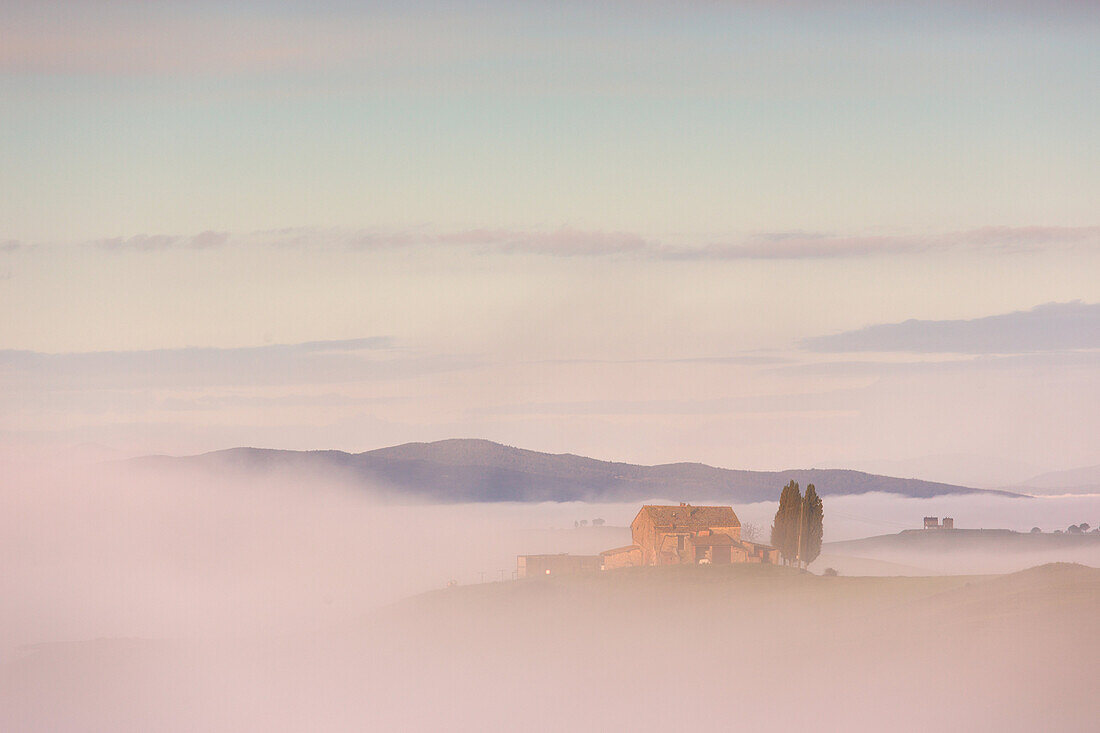 Sunrise in Orcia's valley with fog, Tuscany